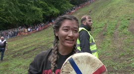 North Carolina woman rolls her way to victory in BRUTAL cheese rolling contest in UK
