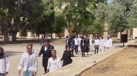 Israeli settlers enter the Al-Aqsa Mosque compound under the protection of the Israeli police, in Jerusalem's Old city