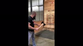 'Ax thrower flawlessly catches a flying 3-inch ring with a double-bit ax 
'