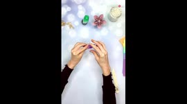 Artist crafts DIY flower art using coloured paper