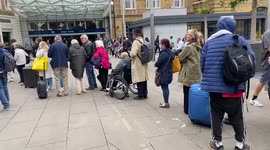 Queues outside King's Cross station as rail workers hold protest