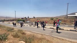 Israeli soldiers argue with Palestinian demonstrators during a protest against Israeli settlements in Jordan Valley, at Tayasir checkpoint