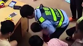 Police officer performs Heimlich manoeuvre to save boy choking on toy in China