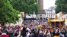 Royal fans cheer the Gold State Coach as it leads Platinum Jubilee Pageant procession along The Mall