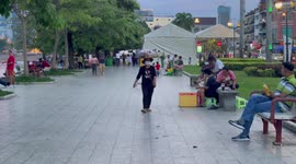 Street vendors balance goods on their head to sell to locals in Cambodia