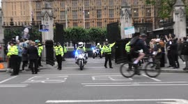 Boris Johnson leaves Parliament surrounded by police as he survives damaging no confidence vote