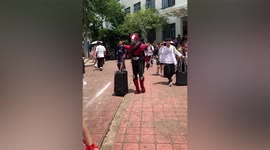 Student dresses up as superhero as he travels to college exams in China