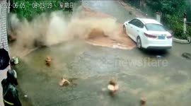 Chickens flee just seconds before wall collapses in southern China