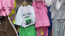 Spot the fakes! Reproduction clothes have amusing spelling mistakes in Cambodia