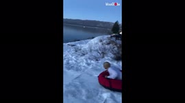 'Adventure-craver goes FULL SEND into freezing cold water *Sledding Gone Wrong!*'