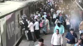 Nimble cop's swift response saves two lives who slip while boarding moving train in western India