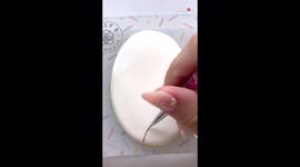 'Artist draws a delicate & super-detailed artwork of leaves on a cookie 
'