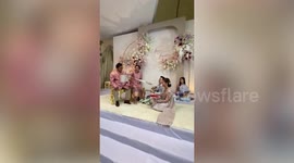 Groom gifts bride's family 'unending' chain of banknotes as wedding dowry