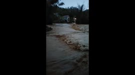 Floodwater gushes through streets as heavy rains hit northern Vietnam