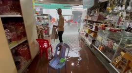 Market floods after heavy rain storm batters Phnom Penh, Cambodia