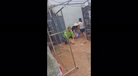 People tried to prevent flood water from entering their houses but failed