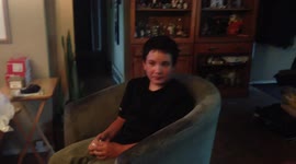 Boy stuffs mouth with marshmallows