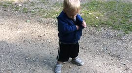 Boy stores rock in his coat