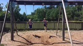 Boy jumps off swings