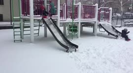 Three boys fall off a slide