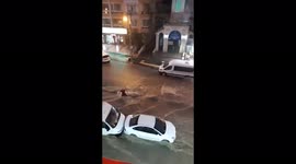 Rapid floodwater knocks man to his feet in Ankara
