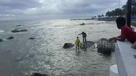 Bungling tourist rescued after posing for selfies on rocks as tide came on Thai beach