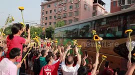 Hundreds of parents line streets in China to send off their children ahead of exams