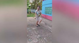 Female teacher does impressive keepy uppy in Thailand