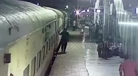 Man slips while boarding moving train in western India, rescued