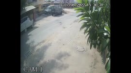 Watch -cctv footage shows  Running cow on road hit and jumps on the bonnet of the car in vadodara