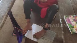 Student, 8, born without arms learns how to write using feet in Myanmar