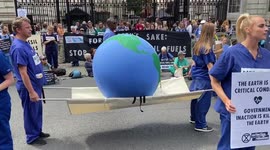 Newsflare Edit - Doctors try to revive a dying Earth during a protest outside Downing St