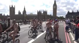 Hundreds of naked bikers pass by British parliament during World Naked Bike Ride London