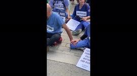 Climate Protesters sit on the road outside Downing Street London 11th June 2022