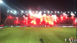 Intimidating scene as thousands Vietnamese football fans use flares to illuminate stadium