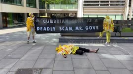 Extinction Rebellion ‘dead canaries’ outside the Home Office in protest against the Cumbrian coal mine