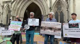 Protesters chant outside Royal Courts of Justice as appeals against Rwanda refugee plan continue