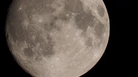 Stunning close-up of nearly full Strawberry Moon setting in Kent, UK
