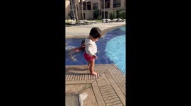 'Fearless 11-month-old swimmer doesn't need any help with stepping into the water 
'