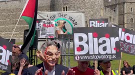 Demonstrators outside Windsor Castle. The are Protesting that former Prime Minister Tony Blair will receive a knighthood from Her Majesty Queen Elizabeth II.