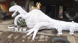 Tire shop owner creates elaborate art pieces with discarded tires