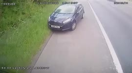 Motorist attempts to stop car driving wrong direction on busy highway near Manchester