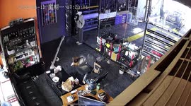 Girl walks face-first into glass door before slipping over after leaving store