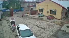 Unmanned vehicle narrowly misses car after rolling out of control in China