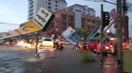 Traffic chaos as billboard collapses onto road during storm in Cambodia