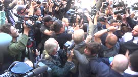 Media mob Kevin Spacey as actor arrives at London court