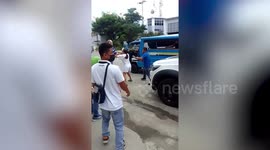 American swings METAL PIPE at taxi driver during road rage fight in the Philippines