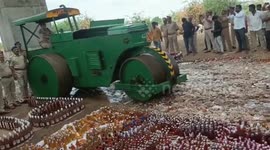 Indian police use truck to crush seized liquor worth $320,000