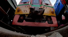 Tourists return to unique market with train line running through in Thailand