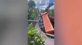 Steel bridge collapses when truck goes over weight limit in the Philippines